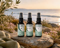 Women's Hormone & Wellness Kit spray bottles labeled Libido Medicine, Cancerbush Medicine, and Menopause Medicine, arranged on a stone outdoors with the sea and sunset in the background. Terupharma
